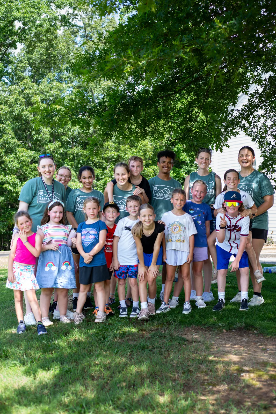 Campers and counselors together on the grass